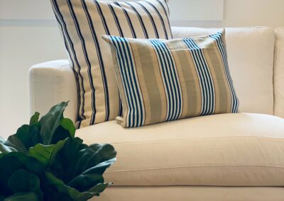 striped cushions on a white linen sofa