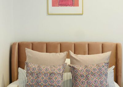pink room with woodblock cushions in front of long breakfast cushion